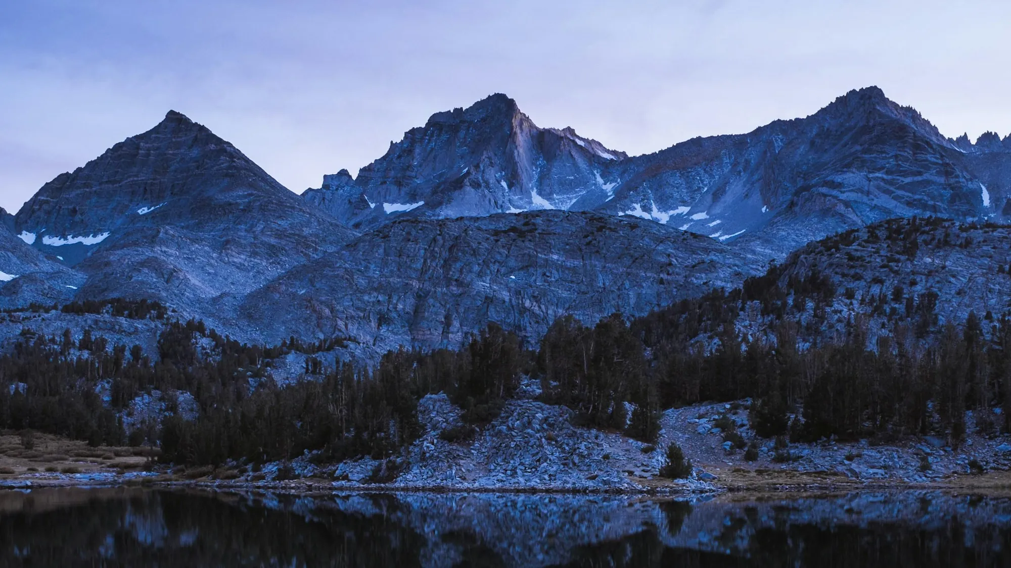 A glacial lake beneath red peaks